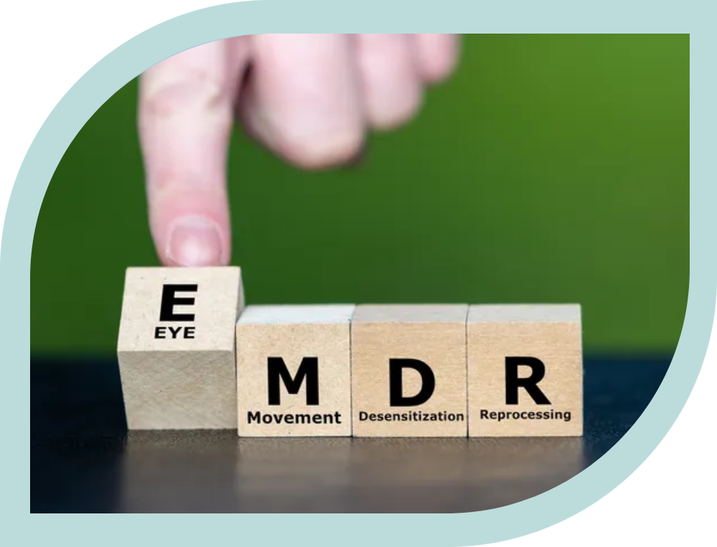 Finger pointing at blocks spelling EMDER related to eye movement.
