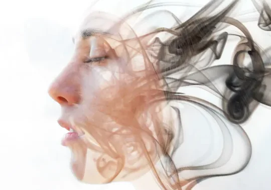 Surreal portrait blending a woman's face with flowing smoke shapes.